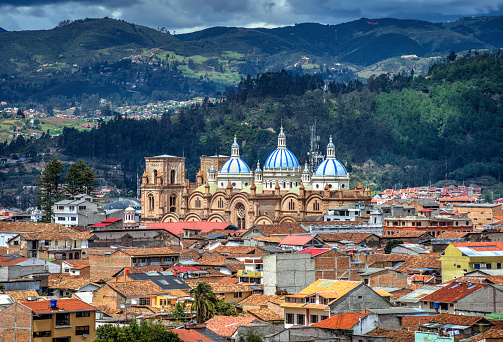 Cuenca's Cathedral La Inmaculada Concepcion, in middle of it's beautiful city, on a sunny and cloudy afternoon. Cuenca, Azuay Province, Ecuador.